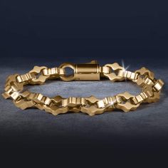 This bracelet is designed to be the perfect match to any outfit. Expertly crafted from premium grade stainless steel with a yellow gold finish. The ornately shaped links are meticulously designed, showcasing detailing that adds a touch of intricacy and luxury. A bracelet that exudes timeless elegance and sophistication. Luxury Gold-tone Metal Bracelet, Luxury Stainless Steel Chain Bracelet With Rectangular Links, Elegant Metal Gold Bracelet With Box Chain, Elegant Gold Box Chain Bracelet, Luxury Gold-tone Box Chain Bracelet, Elegant Yellow Gold Stainless Steel Bracelets, Elegant Yellow Gold Stainless Steel Bracelet, Gold Stainless Steel Oval Link Bracelets, Rectangular Links Jewelry In Yellow Gold Stainless Steel