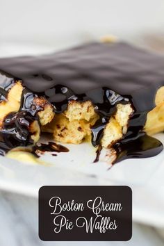 boston cream pie waffles on a plate with chocolate drizzled over them