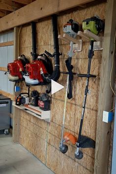 a garage with tools hanging on the wall