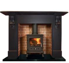 a fire place with a wood burning stove in the middle of it's mantle