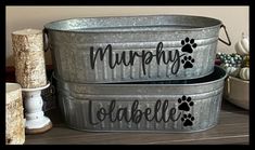 two metal tubs with dog paw prints and the words murpfy, waffleie