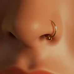 an ear piercing is shown on the side of a mannequin's head