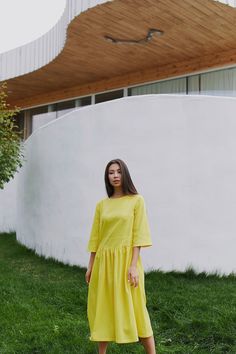 "Introducing our yellow linen smock dress, a vibrant and stylish choice for any occasion. This linen swing dress features a loose and comfortable fit, allowing for easy movement and a relaxed silhouette. The linen fabric adds a natural and breathable element, perfect for warm summer days. Whether you're attending a casual gathering or a formal event, our linen shift dress is a versatile option that can be dressed up or down. The empire waist design of our formal linen dress creates a flattering Relaxed Fit Linen Dresses For Spring, Spring Sundress In Linen With Relaxed Fit, Spring Linen Sundress Mini Dress, Yellow Relaxed Fit Dress For Summer, A-line Linen Mini Dress For Day Out, Linen Sundress For Spring, Spring Linen A-line Midi Dress, Relaxed Fit A-line Linen Midi Dress, Relaxed Fit A-line Linen Dress