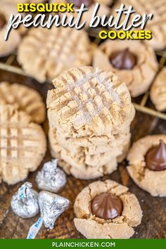 peanut butter cookies on a wooden table with chocolate candies