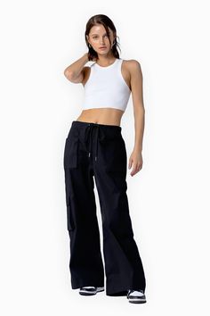 Look cool without even trying. The Rhode Parachute Pants are a key element in building the ultimate It girl wardrobe. Their relaxed fit and wide leg design provide maximum comfort making them the perfect “everyday” pant for the fashion girlies. COLOR: BLACK DETAILS Elasticated waistband with drawstring fastening Relaxed fit Low rise Wide leg Utility pocket design 95% Cotton, 5% Elastane Please refer to the care label for garment care instructions SIZE & FIT: runs TTS, model wears size S MODEL IN Fashion Girlies, Everyday Pants, Girls Wardrobe, Leg Design, It Girl, Care Label, Look Cool, S Models, Pocket Design