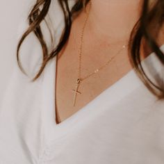 Our popular vertical cross pendant is a subtle statement to add sparkle to any look. split 18k gold-filled vertical cross pendant + CZ accent stones Your choice of chain length (16", 18", or 20") All materials are lead & nickel free Handmade with love by Luna & Jade in the U.S. Jewelry Handmade, Chain Lengths, Cross Pendant, Chain Length, Personalized Jewelry, Cross Necklace, Arrow Necklace, Gold Filled, With Love