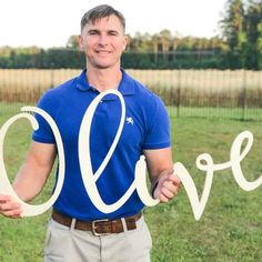 a man holding the word love in his hands