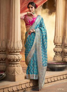 Transform into a vision of elegance with our Ocean Blue Banarasi Silk Saree. This stunning piece features a beautiful lace border and a contrast heavy embroidered blouse, perfect for special occasions. Made from luxurious Banarasi silk, this saree exudes sophistication and makes a great gift for bridesmaids. Elevate your wardrobe with this designer piece today! The unstitched blouse can be customized upto 44 inches. Do Note: All the accessories shown are for styling purpose only. Slight color va Peach Saree, Purple Saree, Orange Saree, Indian Designer Sarees, Indian Saree Blouse, Readymade Saree, Satin Saree, Elegant Saree, Organza Saree