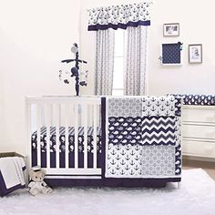 a baby crib bedding set in blue and white