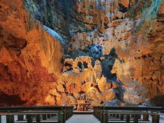 benches are lined up in the middle of a cave