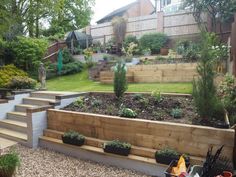 an outdoor garden with steps leading up to it