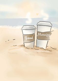 two coffee cups sitting on top of a sandy beach next to the ocean with good morning written on them