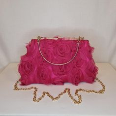 Womens fuschia pink all-over ruffle floral rose pattern evening clutch bag with gold metalwork and top closing clasp Can be used with or without long shoulder chain or small handle (both included) size approx- H 14cm x W 24cm Optional Dust Bag: White lightweight soft polyester portable travel dust bag pouch, suitable for protecting items from dust, dirt, hairs and scratches when not in use size approx- L 47cm x W 31.5cm Material: 100% polyester Please note, there is a cut in the top corner of th Pink Feminine Party Clutch, Pink Clutch With Chain Strap For Formal Occasions, Formal Pink Clutch With Chain Strap, Pink Evening Bag With Chain Strap, Pink Evening Bag With Chain Strap For Events, Pink Clutch With Chain Strap For Events, Chic Pink Bag For Wedding Guest, Hot Pink Bag, Hot Pink Floral