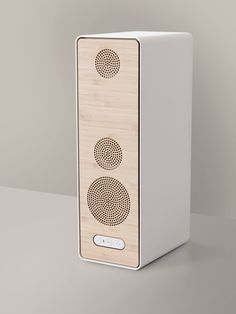 a wooden speaker with two speakers on it