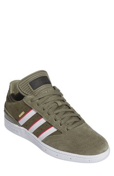 Sporting a timeless trio of stripes, this Dennis Busenitz signature street sneaker features a textured rubber sole and low-profile design. Lace-up style Adiprene sock liner Geofit anti-slip collar Leather upper/textile lining/rubber sole Imported Adidas Three Stripes Skateboarding Sneakers, Urban Sneakers For Skateboarding With Three Stripes, Sporty Striped Low-top Sneakers, Lace-up Skate Shoes With Three Stripes, Lace-up Three Stripes Skate Shoes, Sporty Striped Sneakers With Round Toe, Striped Sporty Sneakers With Round Toe, Sporty Striped Sneakers For Streetwear, Striped Low-top Sneakers For Streetwear