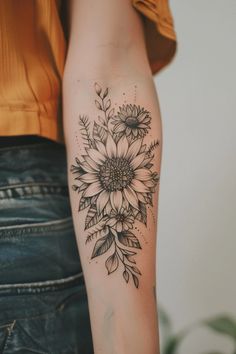 a woman with a flower tattoo on her arm