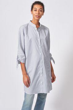 Fabricated in our seasonal multi-stripe pattern, this kimono sleeve spring tunic features a clean band collar with button front closure, tie cuffs, and a shirt-tail hem. the perfect travel top, this breezy cotton shirt defines style for your spring fashion wardrobe. Dress up or down for your travel outfit, or favorite new brunch outfit top. Shop more over 40 womens fashion now at KAL RIEMAN. 40 Fashion Women, Outfit Top, Tie Sleeve, Brunch Outfit