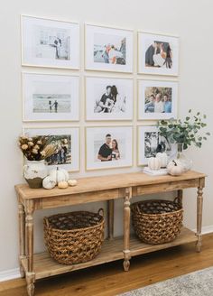 a wooden table topped with pictures and baskets