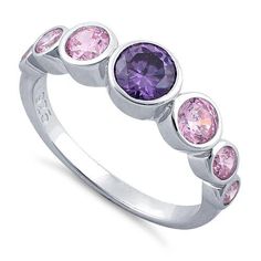 Top of ring height: 6.2mm

Band width: 2.6mm

Shank width: 2.2mm



Stone material: pink & purple cubic zirconia

Center stone size: 5mm

Stone shape: round

Center stone carat weight: 0.46 ct.

Total number of CZ stones: 7

Stone setting: bezel setting



Metal: 925 sterling silver

Plating: rhodium plated

Finish: high polish Pink Sapphire Ring With Cubic Zirconia Center Stone, Purple Cubic Zirconia Birthstone Ring, Pink Birthstone Ring With Brilliant Cut, Purple Cubic Zirconia Round Cut Rings, Purple Cubic Zirconia Birthstone Ring Round Cut, Pink Crystal Ring With Prong Setting, Pink Cubic Zirconia Crystal Ring, Pink Round Cut Stackable Promise Rings, Purple Cubic Zirconia Rings With Prong Setting