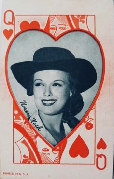 an old photo of a woman in a heart - shaped card with playing cards on it