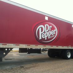 a red truck with the word dr pepper on it's side