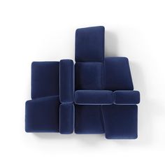 a blue couch sitting on top of a white floor