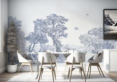 a dining room with a table and chairs in front of a painting on the wall