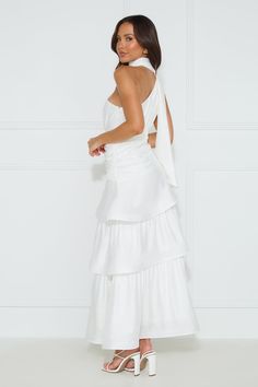 Length from shoulder to hem of size S: 138cm. Chest: 40cm, Waist: 32cm, across front only of size S. Maxi dress. Semi-lined. Model is a standard XS and is wearing size XS. True to size. Non-stretch. One shoulder. Neck wrap. Tiered frill skirt. Crinoline hem. Zipper with hook eye closure. Cold hand wash only. Polyester. We adore the Cara One Shoulder Maxi Dress for all our fancy events. Featuring a neck wrap, a tiered frill skirt and a crinoline hem for a voluminous appearance. Style with heels a One Shoulder Maxi Dress, Frill Skirt, Maxi Dress White, Bridal Shower Dress, Long Bodycon Dress, Maxi Dress Prom, Shower Dresses, Mini Dresses Summer, Neck Wrap