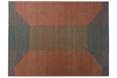 an orange, green and brown rug with squares on it's sides in the shape of a rectangle