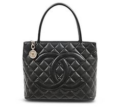 Bring bold style to your everyday look with this beautiful pre-owned tote, featuring a large iconic logo, an elegantly quilted exterior, and plenty of room for necessities. From Chanel. Designer Shoulder Bag With Cc Turnlock For Shopping, Luxury Quilted Double Handle Bag, Luxury Quilted Bags For Daily Use, Classic Bags With Cc Turnlock Closure For Shopping, Designer Quilted Bag With Double Handle, Classic Quilted Shoulder Bag With Double Handle, Elegant Quilted Bag With Double Handle, Classic Quilted Tote Shoulder Bag, Elegant Quilted Shopping Bag