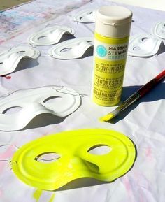 masks and paint sitting on top of a table