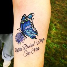 a blue butterfly with words on it and a dandelion in the foreground