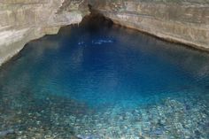 the water is clear and blue in this cave