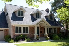 a house with two garages and three windows