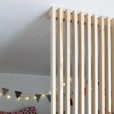 a room with wooden slats on the wall