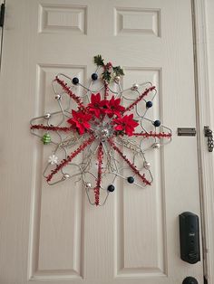 a white door with a christmas decoration on it