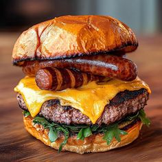 a hamburger with bacon, cheese and lettuce