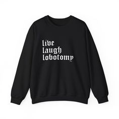 🌚 Embrace the Macabre with a Twist of Humor in Goth Cloth's 'Live Laugh Lobotomy' Sweatshirt 🌚 Goth Cloth proudly presents the 'Live Laugh Lobotomy' Long Sleeve Crew Neck Sweatshirt, a unique blend of gothic style and dark humor. This sweatshirt, with its witty twist on a classic phrase, is perfect for those who appreciate a bit of irony with their gothic aesthetic. Key Features: Witty Gothic Script: The phrase 'Live Laugh Lobotomy' is featured in an eye-catching classic gothic font. Premium C Black Funny Slogan Sweatshirt, Funny Black Slogan Sweatshirt, Funny Black Sweatshirt With Slogan, Alternative Halloween Sweatshirt With Letter Print, Black Band Merch Sweatshirt With Slogan, Live Laugh Lobotomy, Gothic Script, Gothic Font, Gothic Fonts