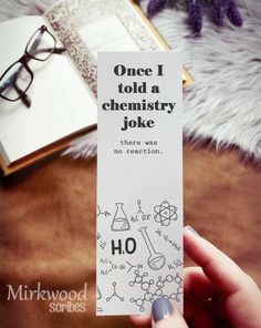 someone holding up a bookmark that says, once i told a chemistry joke there was no reason