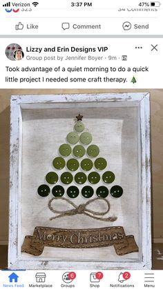 an image of a christmas tree made out of buttons on a wooden frame with the words merry