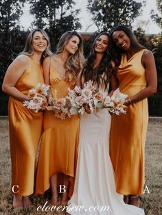 the bridesmaids are all wearing orange dresses and holding bouquets in their hands