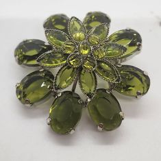 Green Rhinestone Flower Brooch Pendant Olive Green Flower Pin This is a beautiful olive green 3-D flower brooch with green glass and rhinestones.  It would look great on denim shirt, jacket, scarf, etc.  Or add it to your vintage jewelry collection.  It's very cute!  Please see all pictures. Spring Green Brooch Gift, Green Spring Brooches As Gifts, Green Spring Brooches Perfect As A Gift, Green Spring Gift Brooches, Denim Shirt Jacket, Rhinestone Flower, Green Flower, Flower Pins, Green Flowers