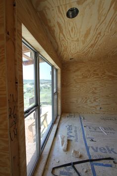 the inside of a house being built with plywood