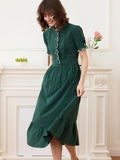 Romina Cotton Vintage Embroidered Green Dress – Simple Retro Fitted Cotton Midi Dress With Ruffles, Fitted A-line Midi Dress With Lace Trim, Fitted Mid-length Dress With Ruffles, Mid-length Fitted Ruffle Dress, Fitted Mid-length Ruffle Dress, Fitted A-line Vintage Dress With Ruffles, Fitted Midi Dress With Embroidered Hem, Elegant Cotton Dress With Scalloped Edges, Fitted Mid-length Dress With Ruffle Hem