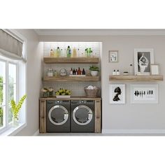 a washer and dryer sitting in front of a window next to a shelf filled with bottles