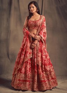 Indulge in the luxurious and exclusive beauty of our Red Floral Digital Printed Embroidered Organza Bridal Lehenga Choli. Designed for women attending Indian weddings, this readymade chaniya choli exudes elegance and grace. The intricate embroidery and vibrant floral print make this dress a must-have for any special occasion. Elevate your guest wear with this statement piece. The unstitched blouse can be customized upto 46 inches. Do Note: All the accessories shown are for styling purpose only. Lehenga Poses, Bride Lehenga, Dupatta Draping, Red Lehenga Choli, Lehenga Choli Designs, Bridesmaid Lehenga, Simple Lehenga, Lehenga Dupatta, Saree Bollywood