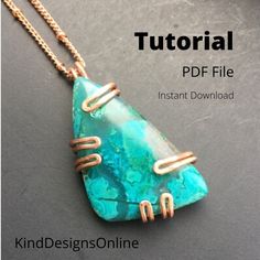 a necklace with wire wrapped around it and a turquoise stone in the middle, on a gray surface