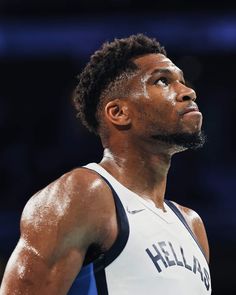 a close up of a basketball player with his head turned to the side and eyes closed