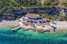 an aerial view of the resort and its surrounding area, with clear blue ocean water