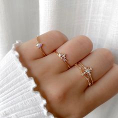 Get ready for compliments. The Beverly ring features three iridescent marquise crystals so it's gleaming from any side. Main material: Rose Gold, Rhodium, 16k Gold Plated on Brass, Cubic Zirconia Need some jewelry inspiration? Follow us on Instagram  @statementGrey Cheap Dainty Cubic Zirconia Rings, Cheap Dainty Rose Gold Midi Rings, Hand Jewelry Rings, Galaxy Ring, Trendy Rings, Pretty Jewelry Necklaces, Chique Outfits, Gold Rings Fashion, Gold Ring Designs